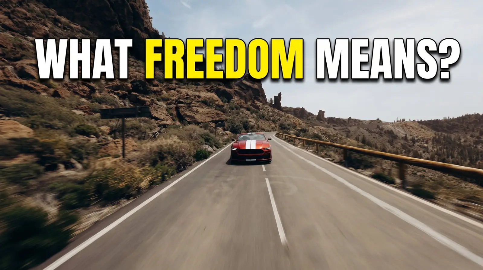 Red Mustang convertible with white stripes driving on a mountain road in Tenerife, with the text What freedom means?